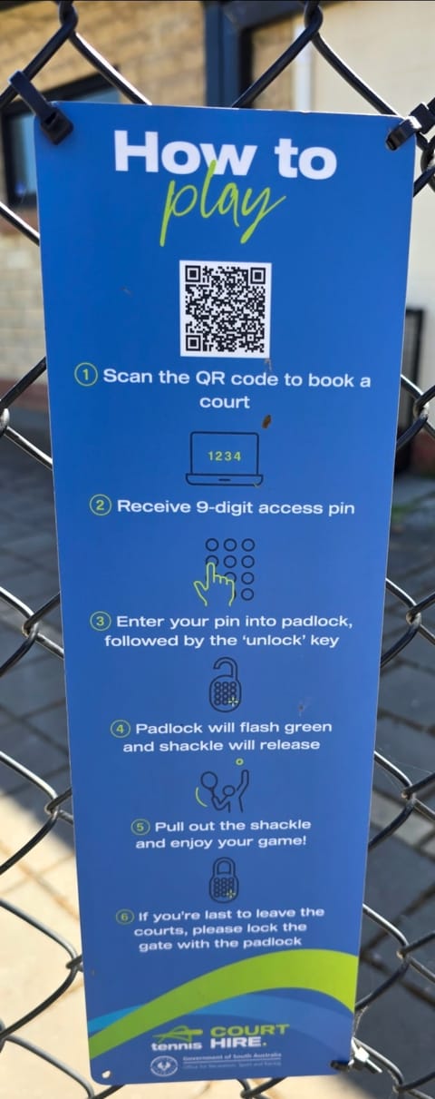 The blue 'How to play' court hire sign on the Essex Park gate, with a QR code and six steps: scan to book, receive a 9-digit PIN, enter it into the padlock, wait for green, pull out the shackle, and lock the gate if you're last to leave
