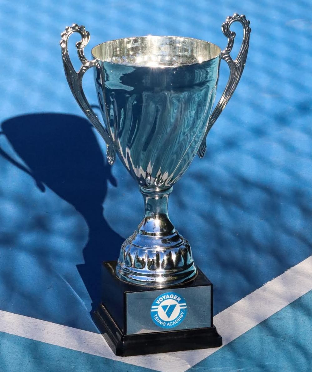 A Voyager Tennis Academy pickleball tournament trophy on the court